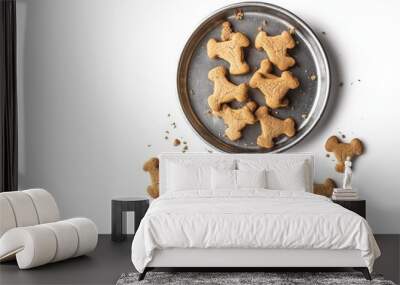 The combination of a white background and a pewter dish shows an assortment of doggy biscuits Wall mural