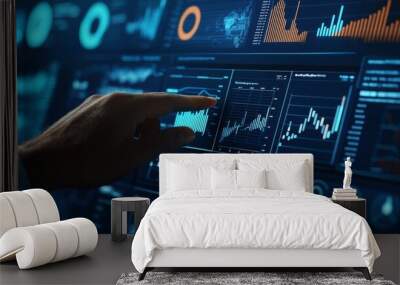 The hands of a businessman are touching a financial graph on a digital screen. Wall mural