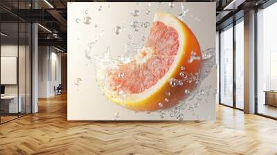 Water splashes over falling grapefruit fruit on white background. Lots of crystal drops. Wall mural