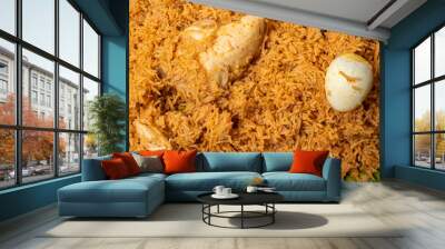 Close up shot of hot chicken biryani with egg and chicken pieces on banana leaf. Wall mural