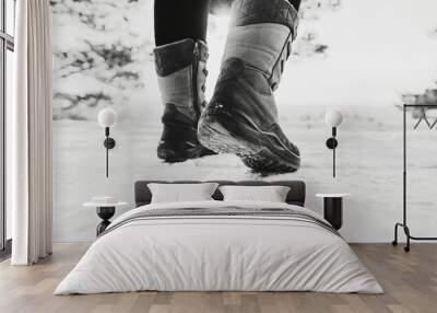 Womens winter jackboots. Black and white toned image  Wall mural