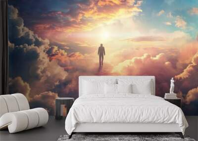 An individual walking through clouds in the sky after death up a stairway to heaven Wall mural