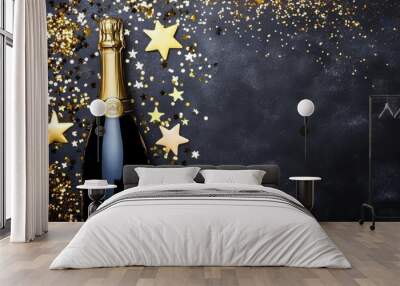 Bokeh lights and golden stars surround a bottle of champagne. Wall mural