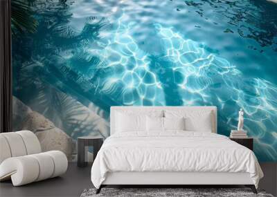 On the top view of a swimming pool is a water ring with a palm shadow on travertine stone. Wall mural