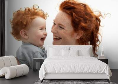 The mother and daughter smile together on a white background in a happy family moment Wall mural