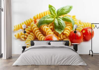 White plate with pasta, tomatoes, basil, and pepper Wall mural