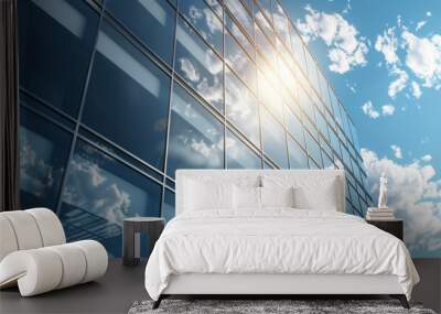 With large windows in a modern aluminum cladding facade, a graphite facade sits against a blue sky. Wall mural