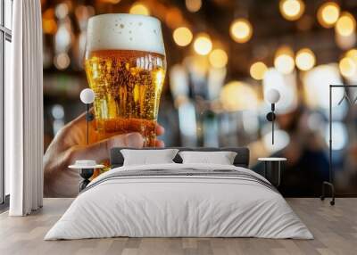 Yellow beer with white foam on top, close-up Wall mural