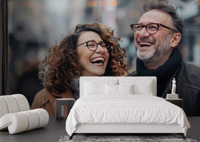 Laughing couple, brown curly hair, man in glasses, stylish mall shopping day, happy and walking. Wall mural