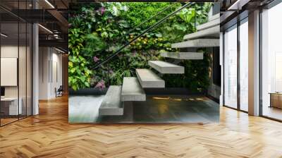 Minimalist concrete stairs with thin black metal railings, contrasting beautifully with a lush indoor vertical garden backdrop in a modern home. Wall mural