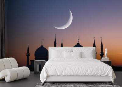 A conceptual image of a crescent moon and mosque silhouettes, celebrating the beginning of the Islamic lunar year. Wall mural