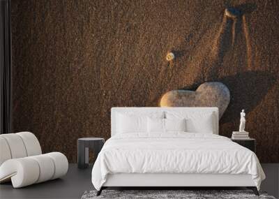 Stone heart on the pebble beach. Love concept. Valentine background Wall mural