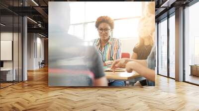 unposed group of creative business people in an open concept office brainstorming their next project Wall mural