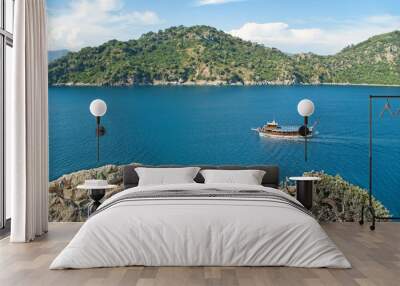 view of sea bay with tourist boat from cliff Wall mural