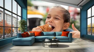 little boy eats fried chicken Wall mural