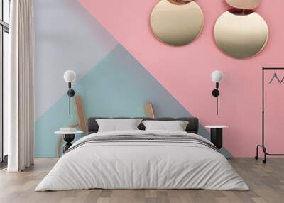 Two pairs of Modern Golden earrings on pink and blue geometric layout made of paper Wall mural