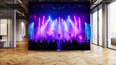 The stage glowed with bright purple and blue lights, making the performance feel lively and exciting. Wall mural