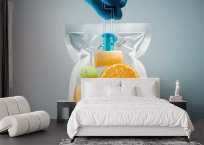 Doctor keep sliced fruit in an IV bag. Doctor holding saline bag fruit. Fruits Serum. iv serum bag. Generative AI Wall mural