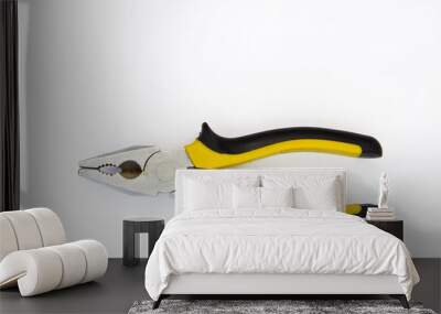 Pliers black and yellow tool on white Wall mural