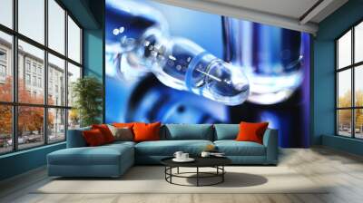 Ampoles with medicine in blur. Ampoules with injection in blue. Wall mural