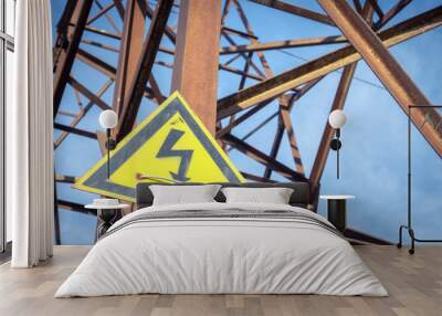 High voltage warning sing on an electricity pole. Yellow high voltage sign. Risk of electrick shock.  Wall mural