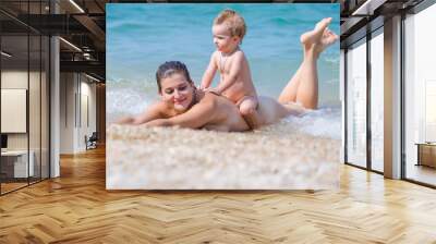 Mother with baby at the sea Wall mural