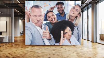 Creative, fun and business team taking a selfie together while in a corporate office. Happy employee friends taking a silly, funny and comic work picture in the company conference room. Wall mural