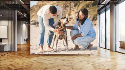 Beach, happy and couple with dog by ocean for freedom, adventure and bonding together in nature. Happy pet, domestic animal and man and woman play by sea for exercise, wellness and walking in nature Wall mural