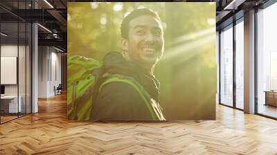 Man, backpacker or hiker in sunshine forest, trekking woods or nature trees in adventure, morning exercise or Japanese fitness. Smile, happy or hiking in sunrise environment, lens flare or wellness Wall mural