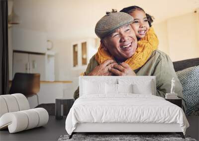 Hug, grandparent playing or happy child in family home on sofa with love or care bonding together. Piggyback, living room couch or senior grandfather with young girl, smile or kid to relax in house Wall mural