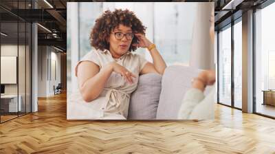 Talking, bonding and friends sharing a story, secret or gossip on the sofa together. Happy, relax and women on the living room couch for advice, communication and catching up conversation at home Wall mural