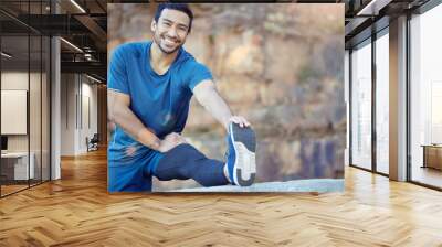 Portrait, sports and stretching with a man runner outdoor in the mountains for a cardio or endurance workout. Exercise, fitness and smile with a young male athlete getting ready for a run in nature Wall mural