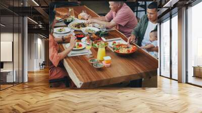 Family home, lunch and thanksgiving food on table with kids, plate and baby for festive celebration. Men, women and children in dining room, house and together at event, party and holiday brunch Wall mural