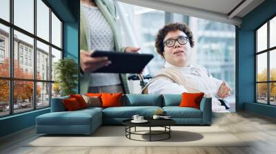 Tablet, discussion and business woman in wheelchair online for meeting, planning and talking. Office building, corporate team and person with disability in corridor on digital tech for collaboration Wall mural