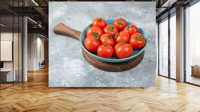 Blue bowl full of red fresh tomatoes on marble background Wall mural