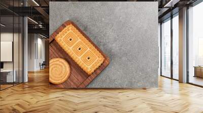 Crunchy tasty biscuits on wooden plate Wall mural