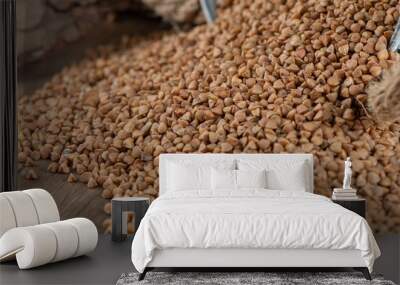 Pile of raw buckwheat out of metal bucket Wall mural