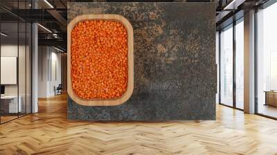 Raw red lentils on wooden plate Wall mural