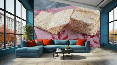 Stack of tasty crispbread on red cloth Wall mural