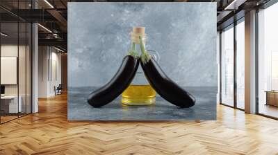 Two fresh eggplant with bottle of oil Wall mural