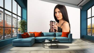 Woman in black top holding cup of coffee Wall mural