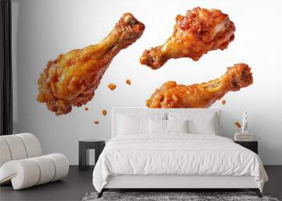 Fried chicken legs falling in the air isolated on white background Wall mural