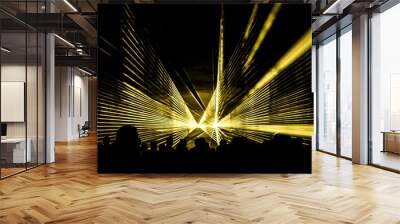 Yellow laser show nightlife club stage with party people crowd. Luxury entertainment with audience silhouettes in nightclub event, festival or New Year's Eve. Beams and rays shining colorful lights Wall mural