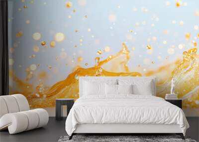 A splash of orange liquid is splashing out of a container Wall mural