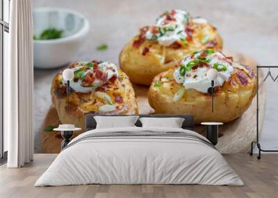 Baked loaded potato with bacon, cheese, sour cream and onion Wall mural