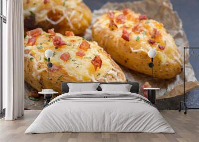 Baked loaded potato with bacon, cheese and onion Wall mural