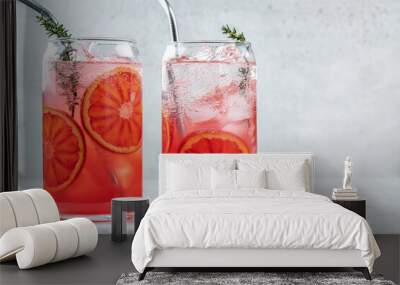 Blood Orange lemonade cocktail with ice and thyme on light gray concrete background Wall mural