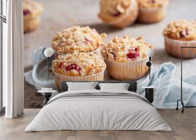 Fresh homemade delicious raspberry muffins on a table Wall mural