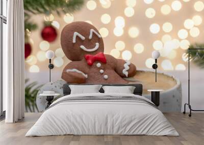 Gingerbread cookie man in a cup of hot chocolate or cappuccino Wall mural