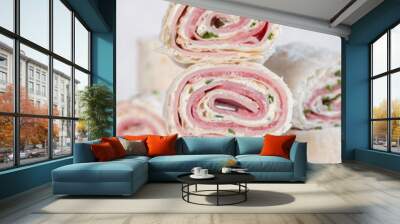 Ham and cream cheese rolled up in a flour tortilla Wall mural